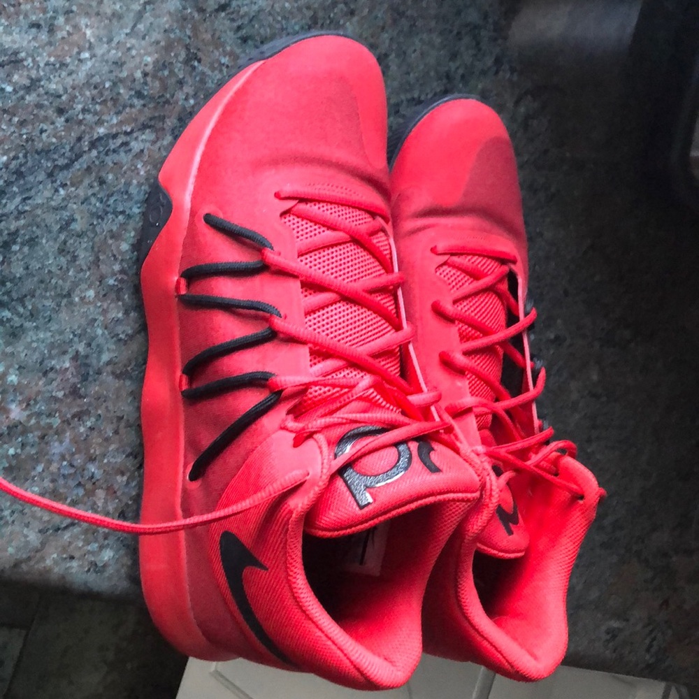I’m selling red and black Nike sneakers
